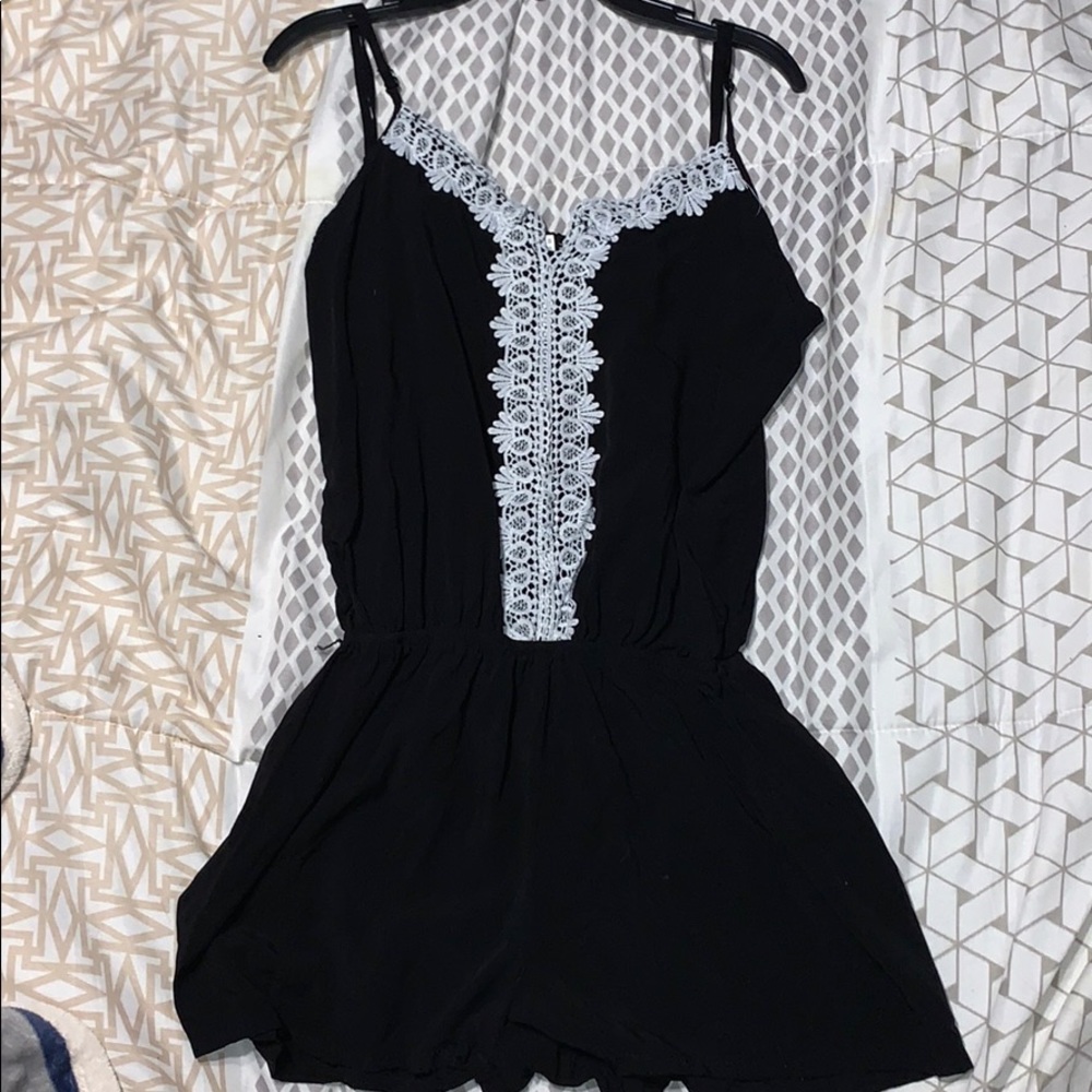 Black date night romper, white lace flower detail